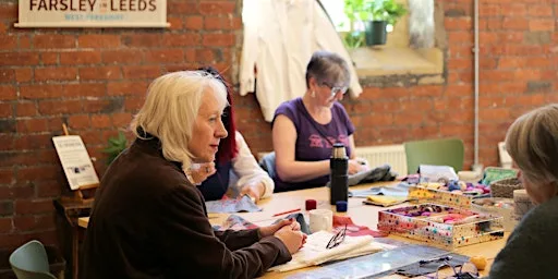 Visible Mending on clothing at Sunny Bank Mills Gallery