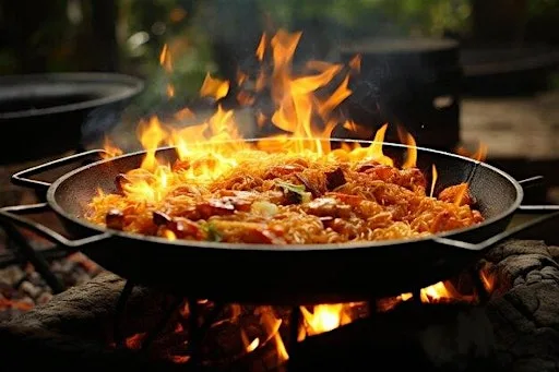 Tapas Night with chicken paella cooked over fire at 51 Carus Ave