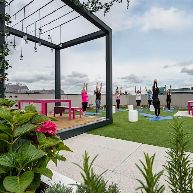 Yoga in secret roof garden over-looking Liverpool City Centre