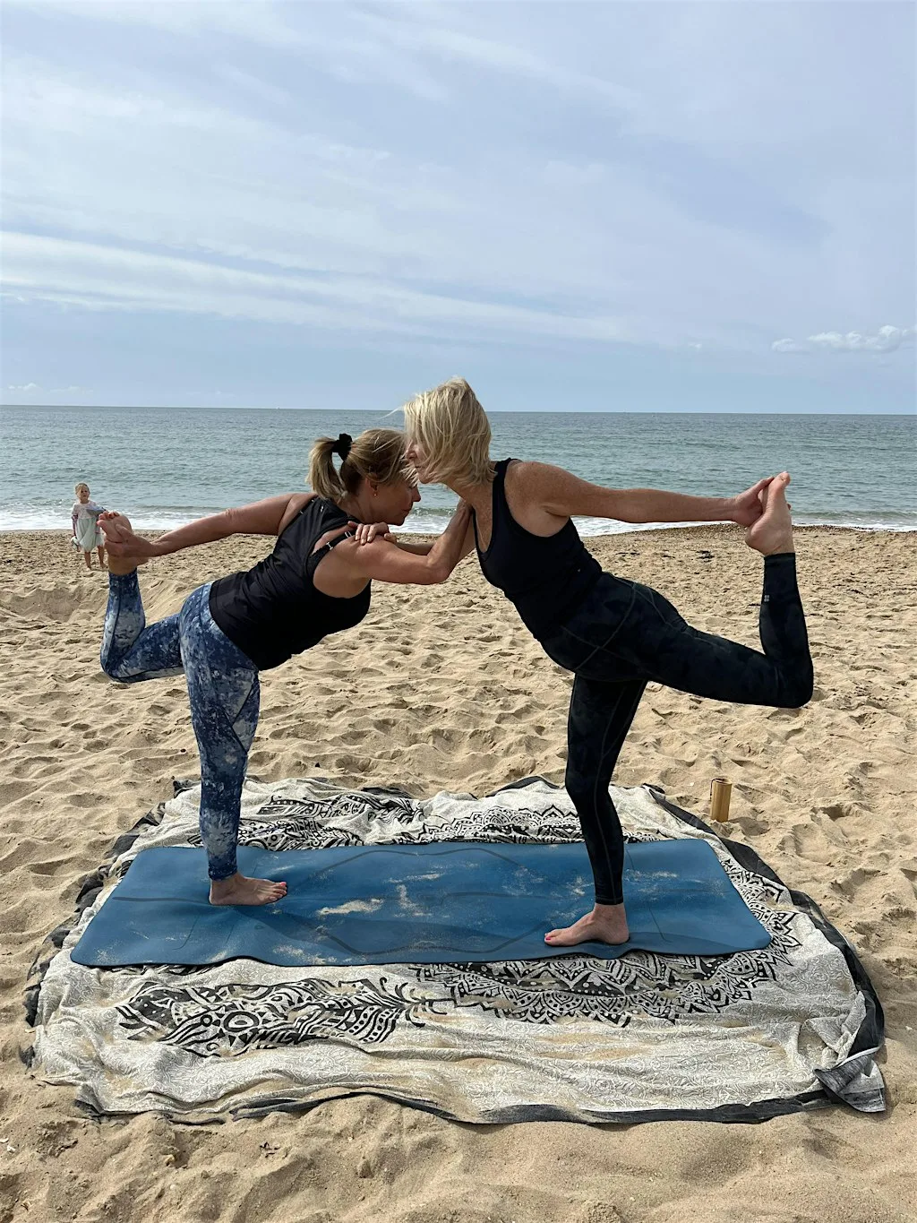 Acro yoga on the beach at Fishermans Walk Beach