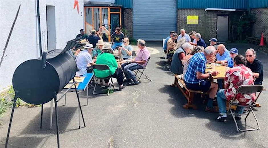 Man with a Pan & Cooking for Carers Summer Feast - Lewes at Lewes Community Kitchen