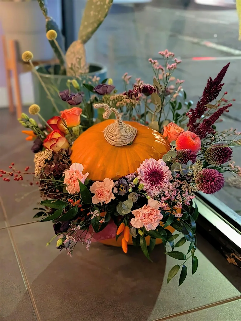 Create a Fun Flower Filled Pumpkin Arrangement!
