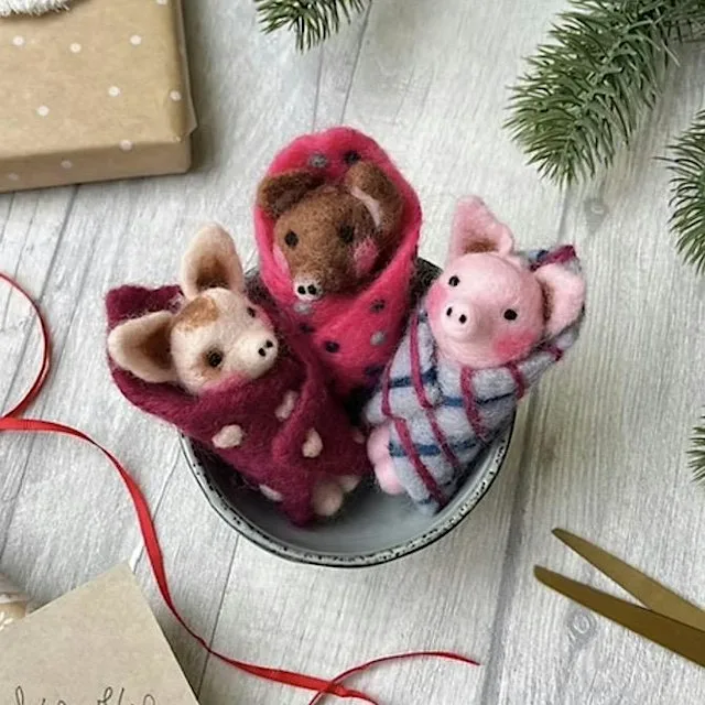 Needle Felted Christmas Pigs in Blankets decorations. at Yarn Etc