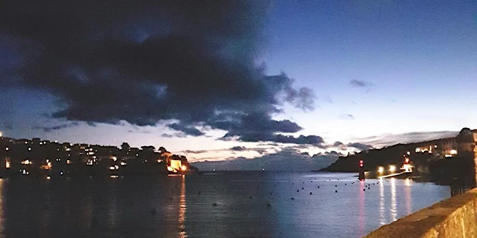 Dusk Walking Tour of Fowey, Cornwall at Caffa Mill Car Park benches overlooking ferry slip